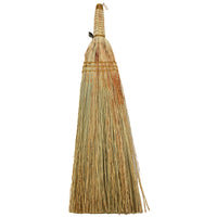 Broom with a natural straw bristle head and wooden handle on a white background