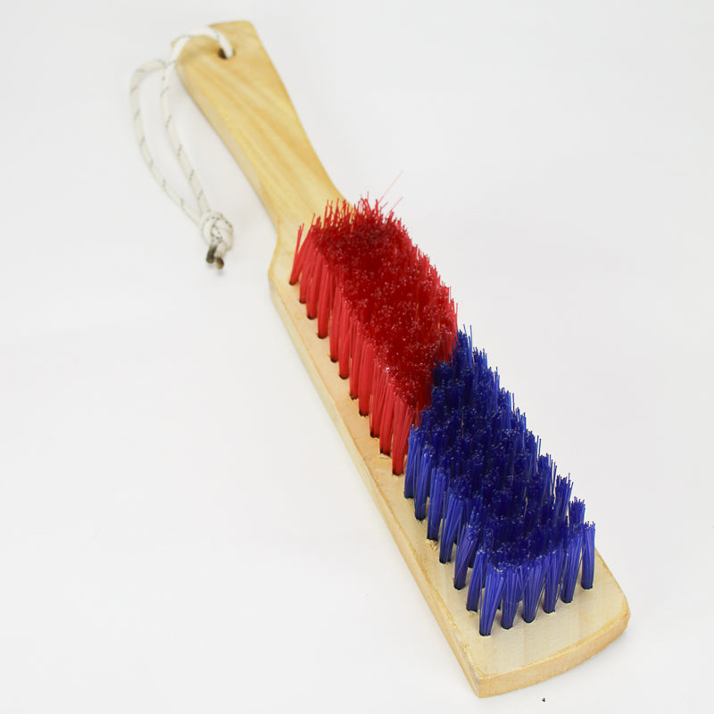 Cleaning brush with red and blue bristles on a white background
